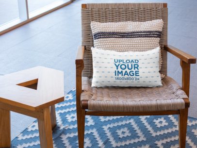 Pillow Mockup on a Woven Chair Next to a Small Wooden Table