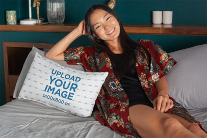 Pillow Mockup Featuring a Woman Smiling on a Bed