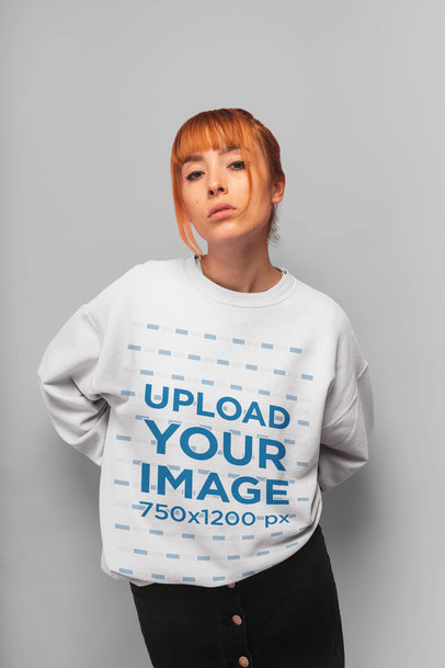 Mockup of a Red Hair Woman Wearing a Crewneck Sweater