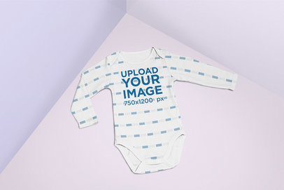 Baby Onesie Mockup Lying in a Multicolored Surface