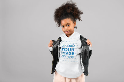 Mockup of a Little Girl with a Curly Ponytail Showing off Her Pullover Hoodie