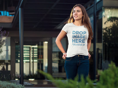 T-Shirt Mockup of a Stylish Woman Walking Around