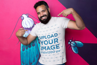 Mockup of a Man Smiling and Pointing at His Own T-Shirt