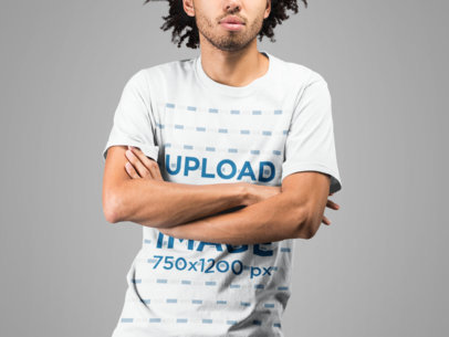 T-Shirt Mockup of a Man with Afro Hair Crossing Arms