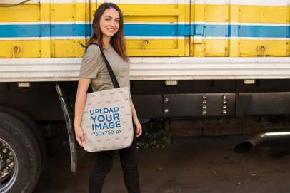 Tote Bag Mockup of a Woman Passing by a Parked Truck 24876