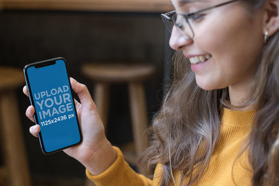 iPhone 11 Pro Mockup Featuring a Happy Woman with Glasses