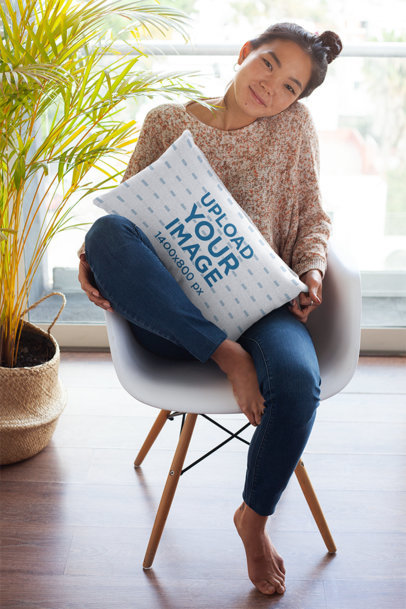 Pillow Mockup Featuring a Pretty Woman Sitting at Home