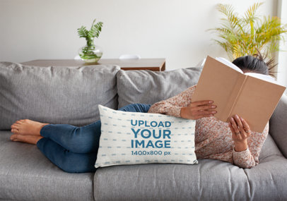 Pillow Mockup of a Woman Lying on a Sofa with a Book on Her Face 