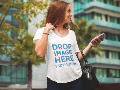T-Shirt Mockup of a Beautiful Woman at an Urban Environment