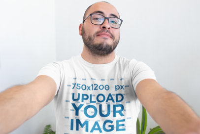 T-Shirt Mockup Featuring a Happy Customer Taking a Selfie