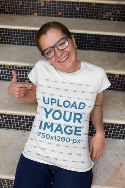 Mockup of a Happy Customer Winking and Pointing at Her T-Shirt