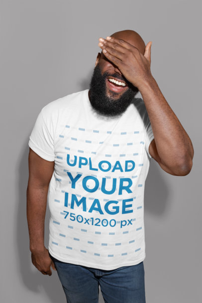 T-Shirt Mockup of a Man with Beard Laughing While Covering His Face