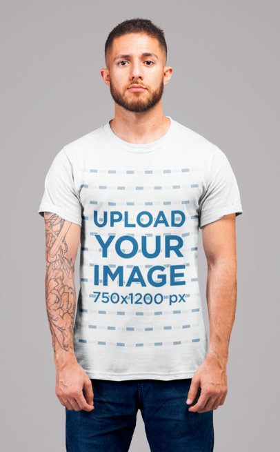 T-Shirt Mockup of a Redhead Man with Tattoos Standing in a Studio