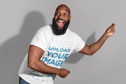 T-Shirt Mockup of a Happy Man Snapping His Fingers 21532