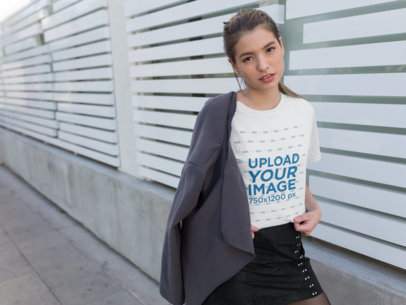 Tee Mockup of a Woman Wearing a Coat over Her Shoulder
