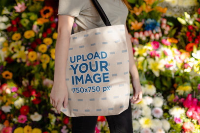 Tote Bag Mockup of a Woman Surrounded by Flowers