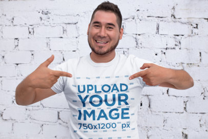 Mockup of a Happy Customer Pointing at His T-Shirt
