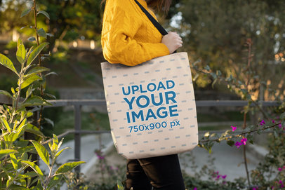 Tote Bag Mockup Featuring a Woman Posing in a Natural Environment 24888
