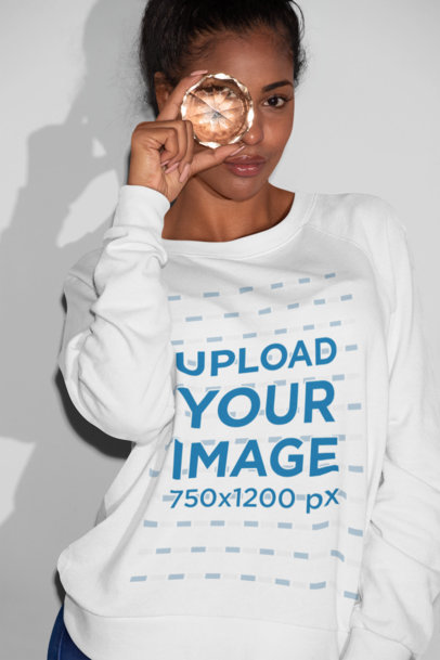 Sweatshirt Mockup of a Woman Looking Through a Stone