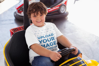 T-Shirt Mockup of a Smiling Kid on a Bumper Car