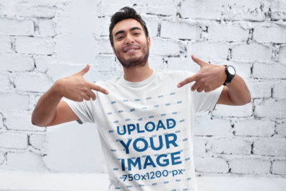 Mockup of a Happy Customer Acting Cool Pointing at His T-Shirt