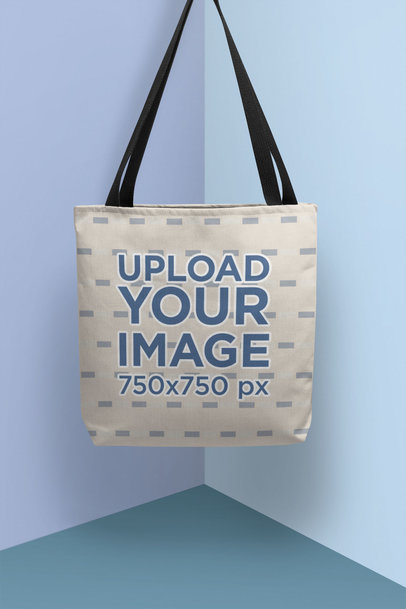 Mockup of a Tote Bag Hanging in a Colorful Setting 