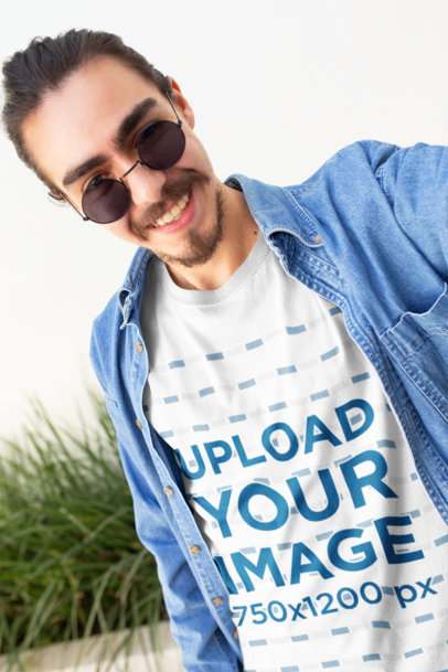 Tee Mockup of a Happy Customer with a Demin Shirt and Cool Sunglasses Taking a Selfie