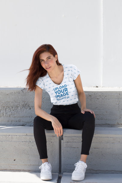 Mockup of a Red Haired Woman Wearing a Sublimated V-Neck Tee