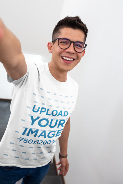 T-Shirt Mockup of a Happy Customer with Glasses Taking a Selfie