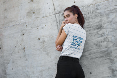 Tee Mockup of a Thin Redhead Woman Leaning on a Wall 