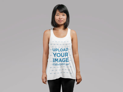 Mockup of a Young Woman Wearing a Loose Tank Top at a Studio