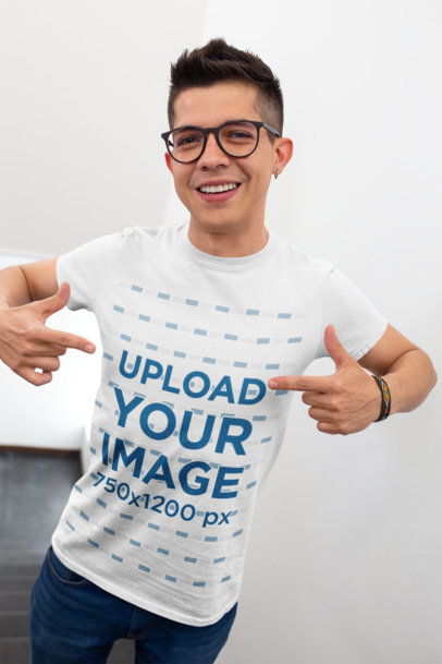 Mockup of a Young Happy Customer Pointing at His T-Shirt
