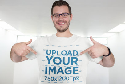 T-Shirt Mockup Featuring a Tall Man Pointing to His Tee 26205