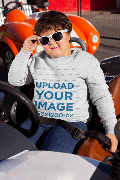 Crewneck Sweater Mockup of a Kid Sitting in a Bumper Car