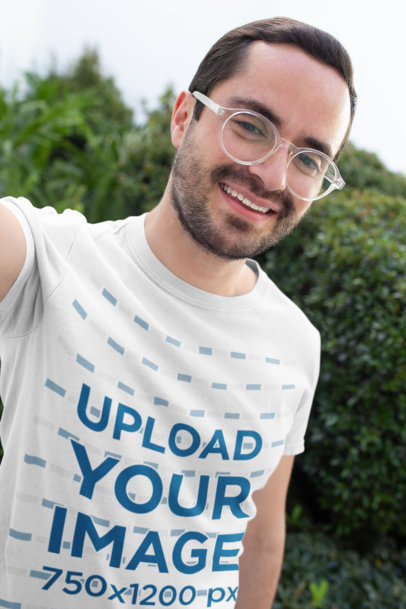 Selfie Mockup of a Happy Customer Wearing a Round Neck Tee