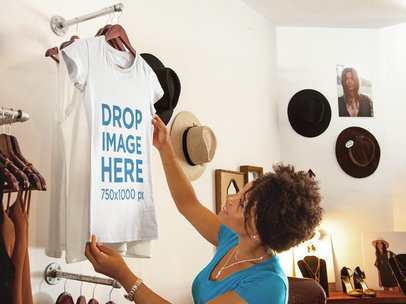 T-Shirt Mockup Featuring a Woman Shopping at a Boutique