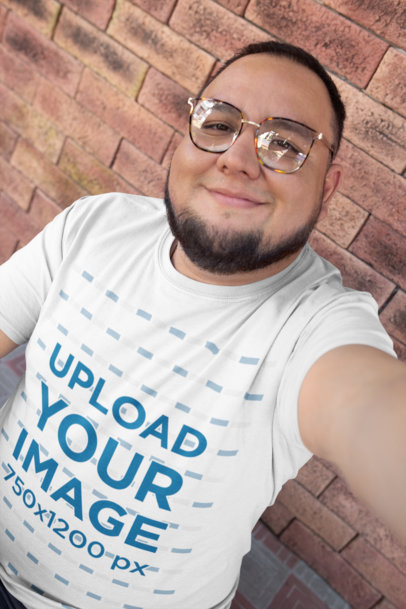 T-Shirt Mockup of a Happy Customer with Retro Glasses Taking a Selfie