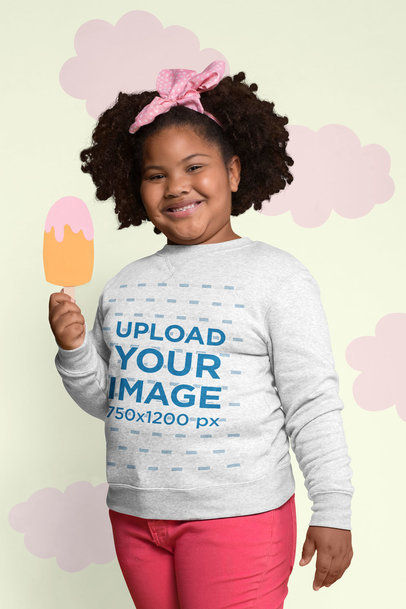 Sweatshirt Mockup of a Smiling Girl Holding a Cartoon Ice Cream