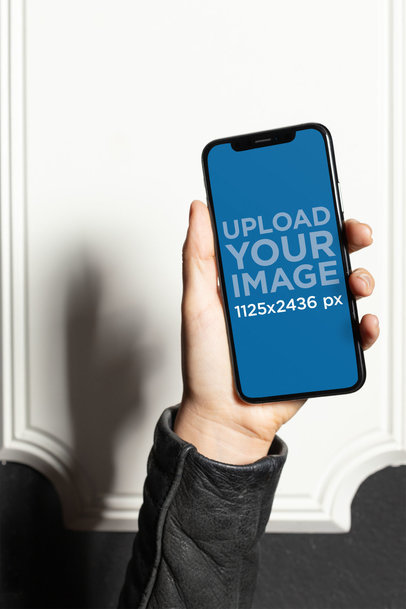 Mockup of a Hand Holding an iPhone XS 25380