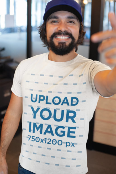 T-Shirt Mockup Featuring a Happy Customer Smiling at the Camera