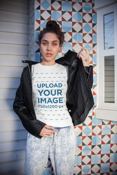Tee Mockup of a Woman in Front of a Mosaic Wall