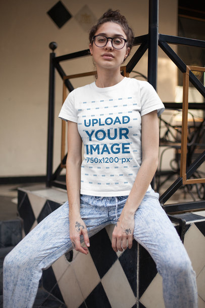 T-Shirt Mockup of an Alternative Woman Sitting in a Vintage Room