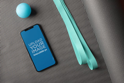 Mockup of an iPhone 11 Pro Max on a Yoga Mat