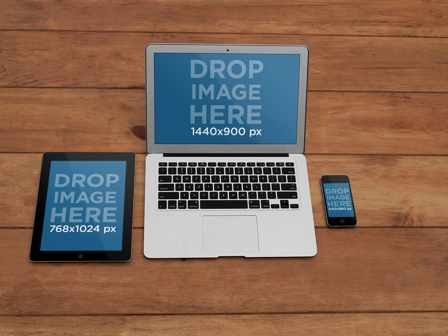 Mockup of an iPad, MacBook, and iPhone on a Wooden Table