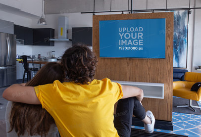 Mockup of a Couple Watching TV in a Modern Flat