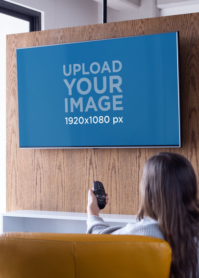 Mockup of a Woman Watching Her Smart TV in a Comfy Living Room 