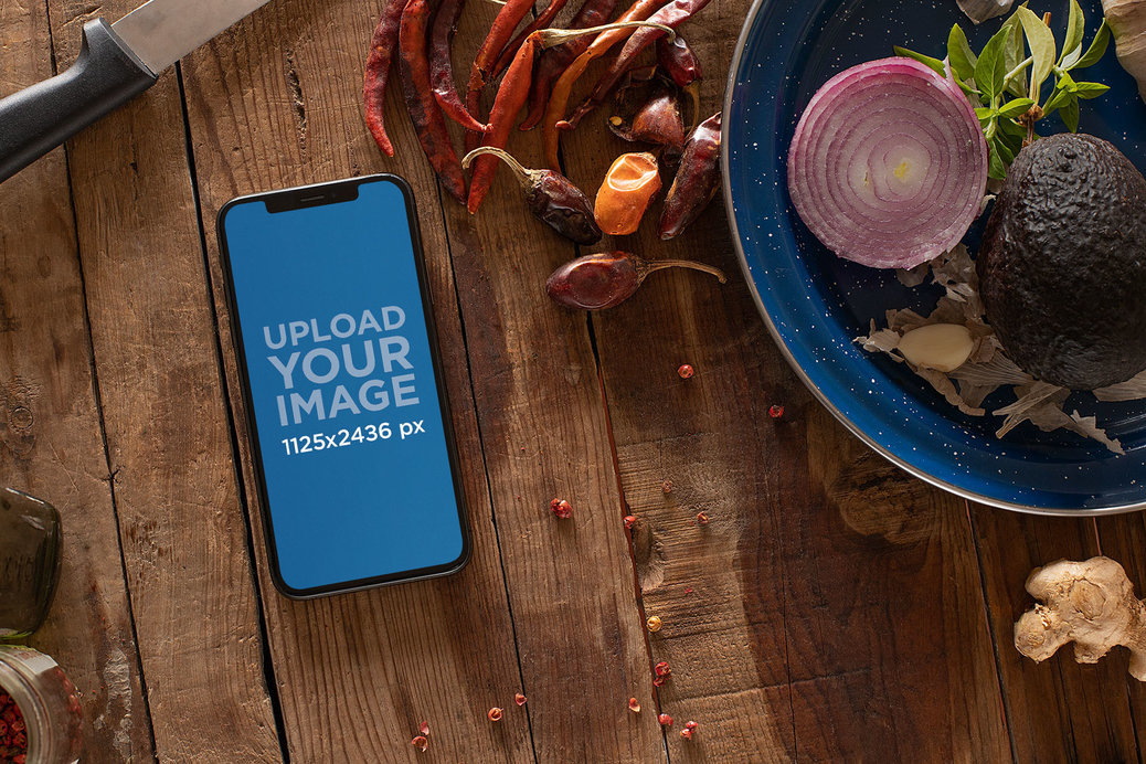 Mockup of an iPhone 11 Pro Surrounded by Vegetables