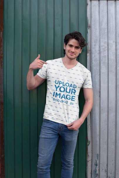 Sublimated V-Neck Tee Mockup of a Handsome Man in Front of Old Aluminum Doors 24999