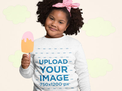 Mockup of an Afro-Haired Girl Wearing a Sweatshirt Holding a Cartoon Popsicle