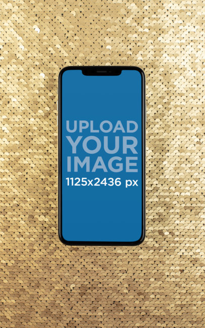 iPhone XS Mockup over a Golden Sequin Surface 25967